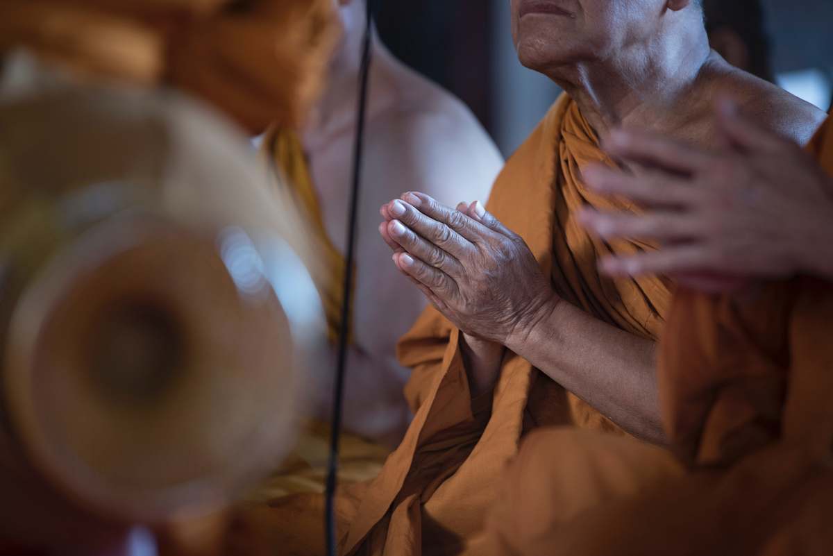 person praying monk human