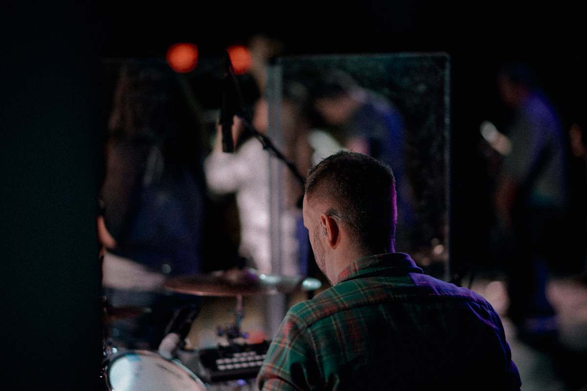 human selective focus photography of man facing crowd person