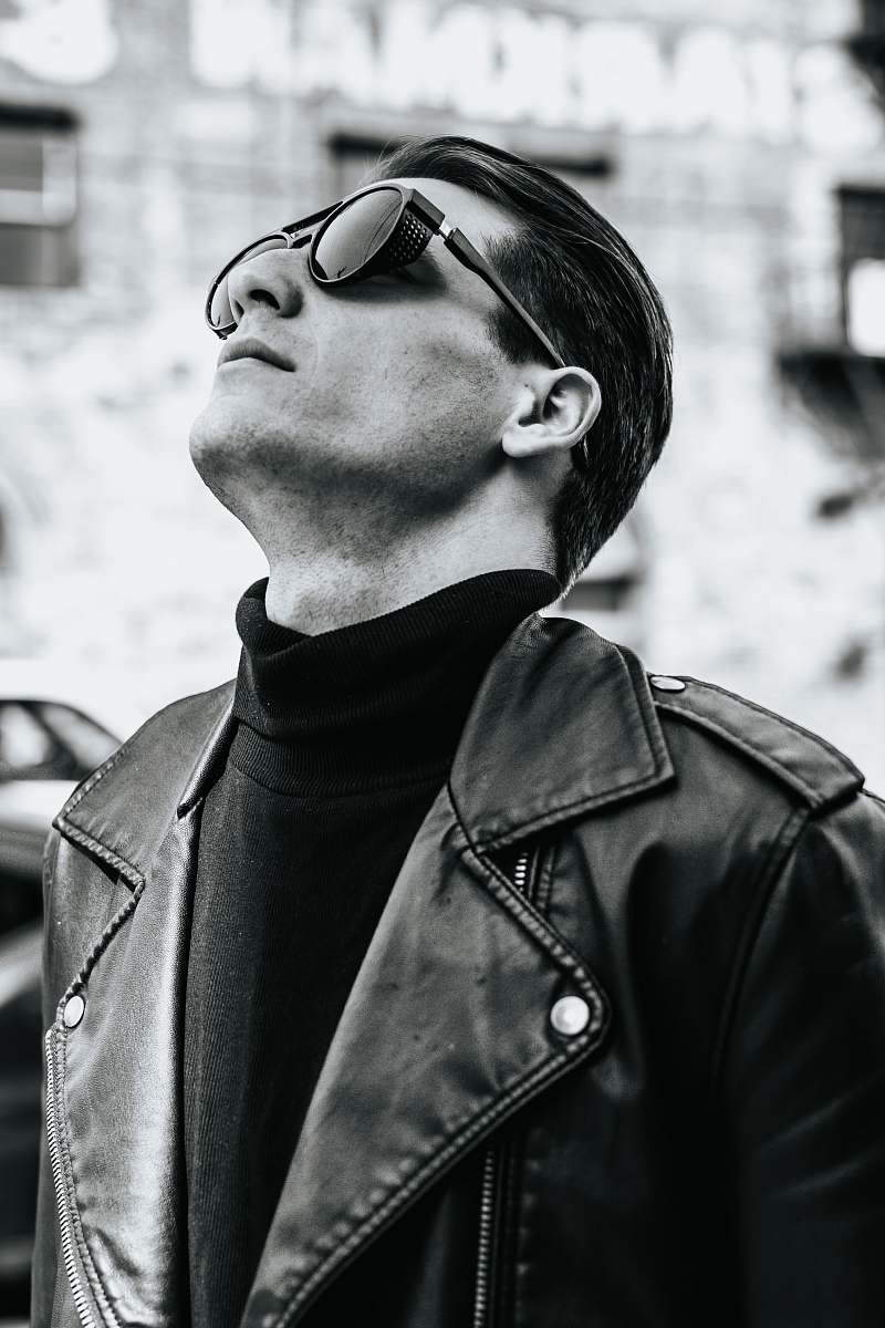 person selective focus photography of man looking up black-and-white