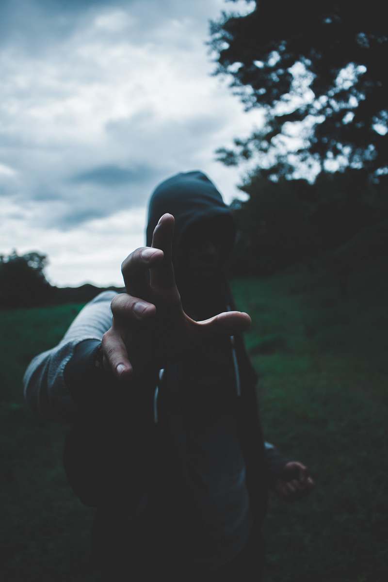 person selective focus photography of man wearing hoodie human