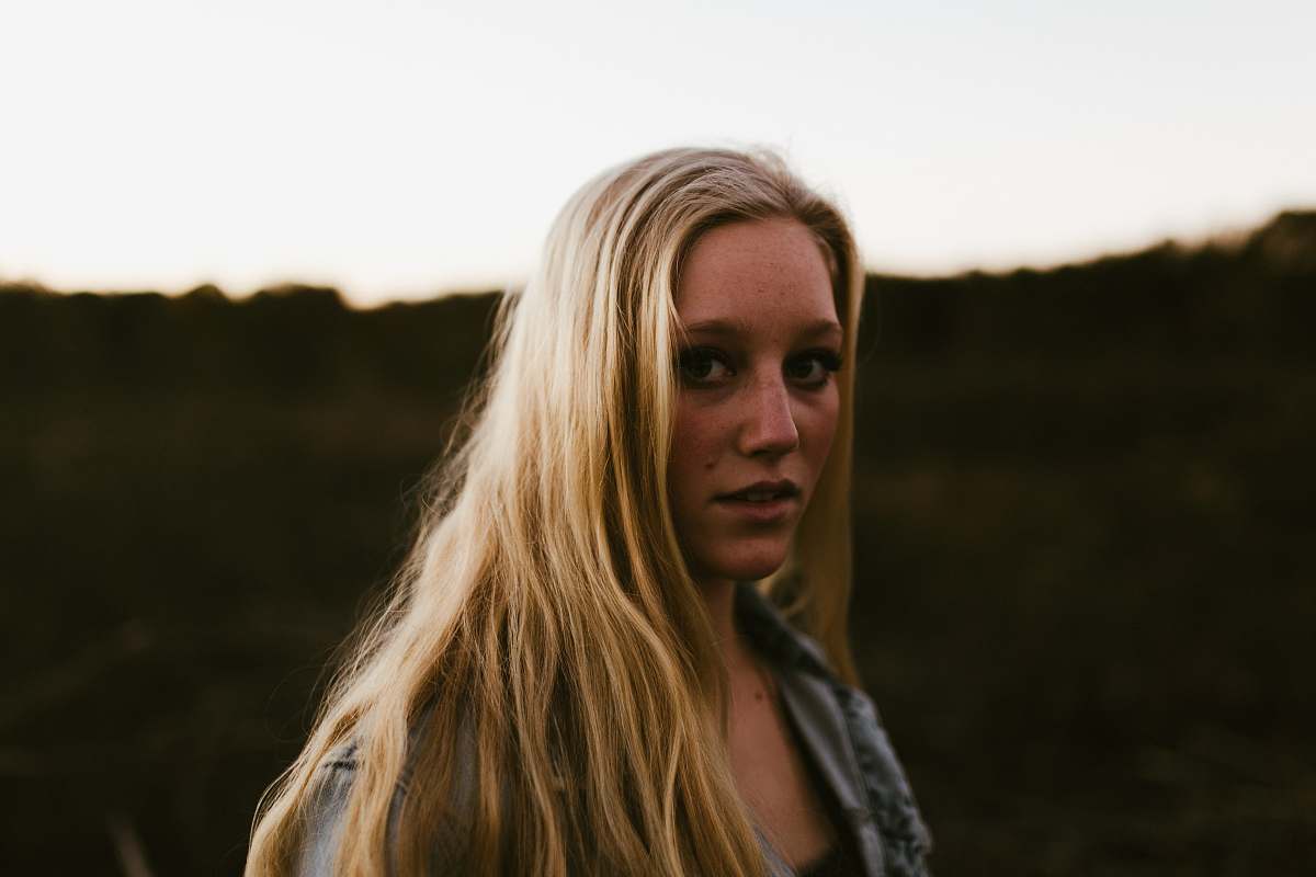 blonde shallow focus photo of woman woman