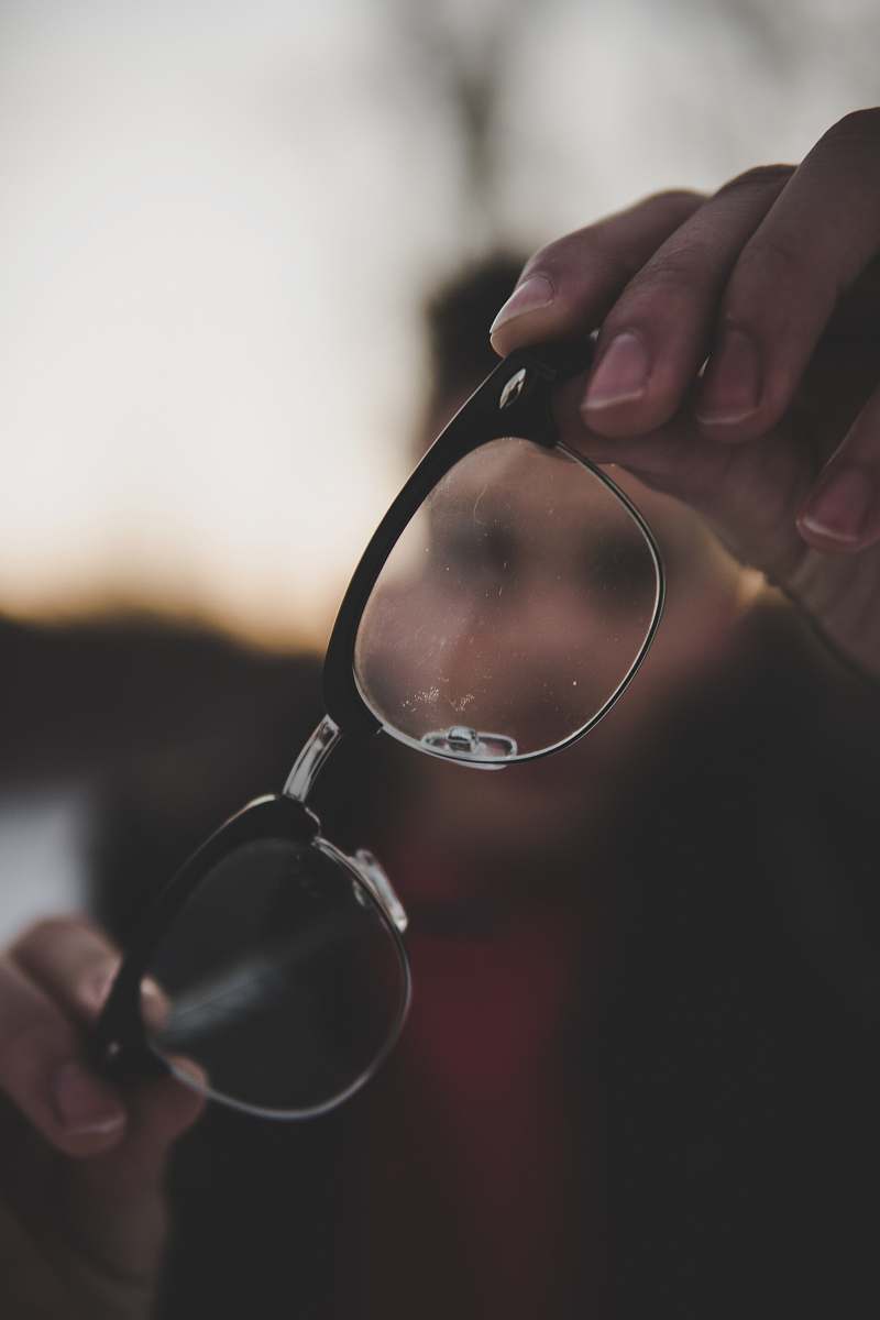 person shallow photography of eyeglasses glasses