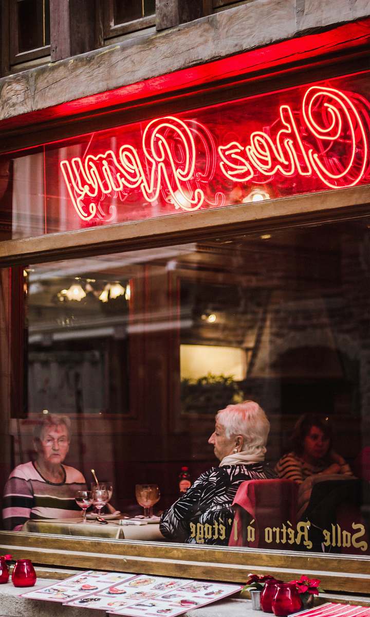flora turned on Chez Remy neon signage during daytime jar