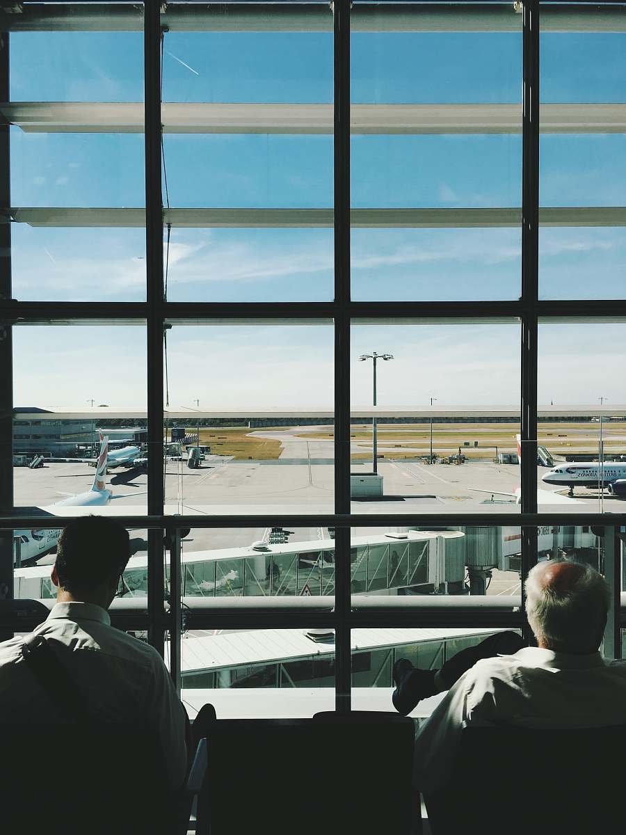 Person Two Men Sitting In Front Of Glass Window During Daytime Human ...