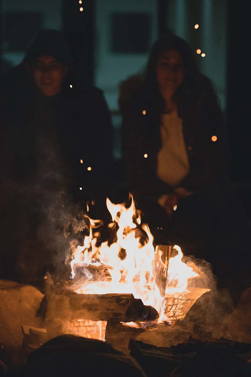 person two person infront bondfire human
