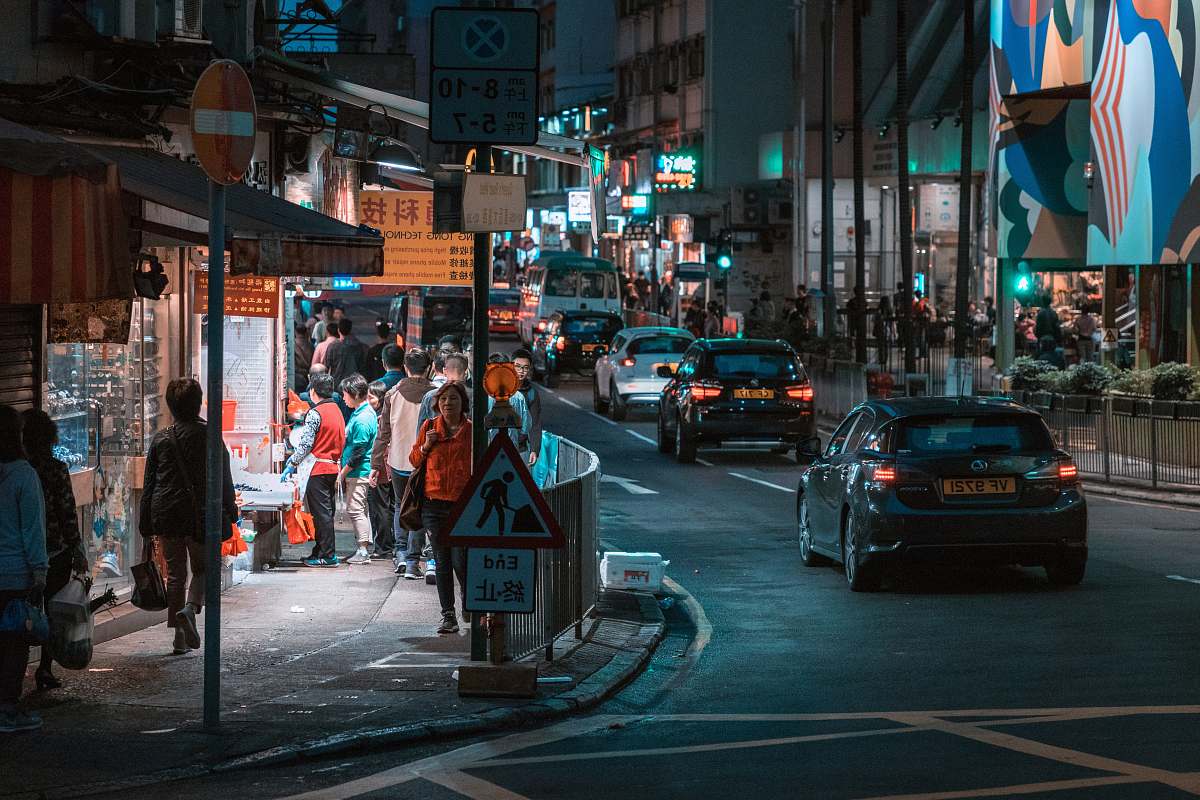 human vehicle and people near building structure person
