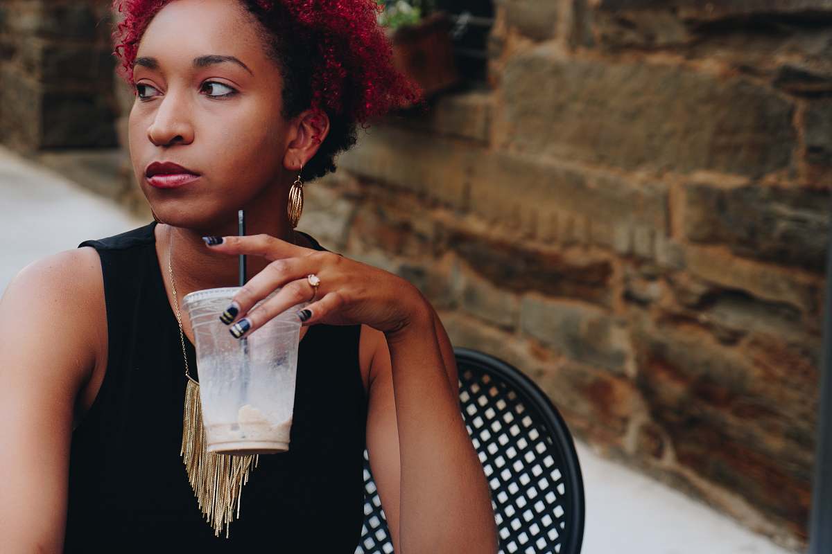 person woman drinking on clear plastic cup woman