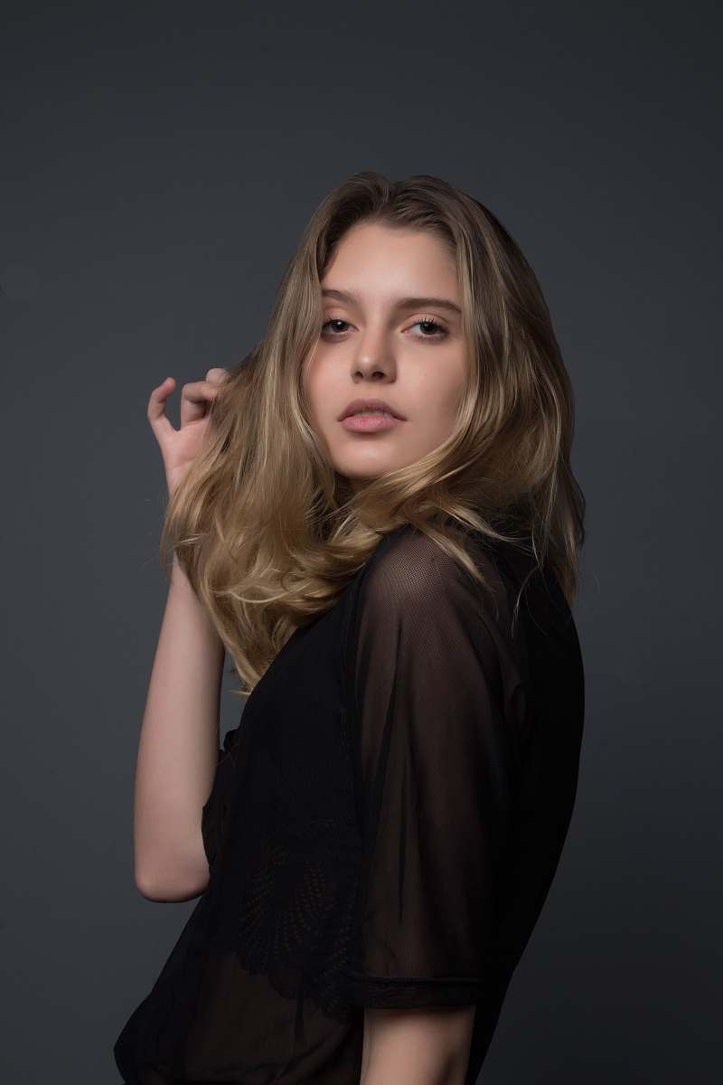woman woman holding heft long blonde hair blonde