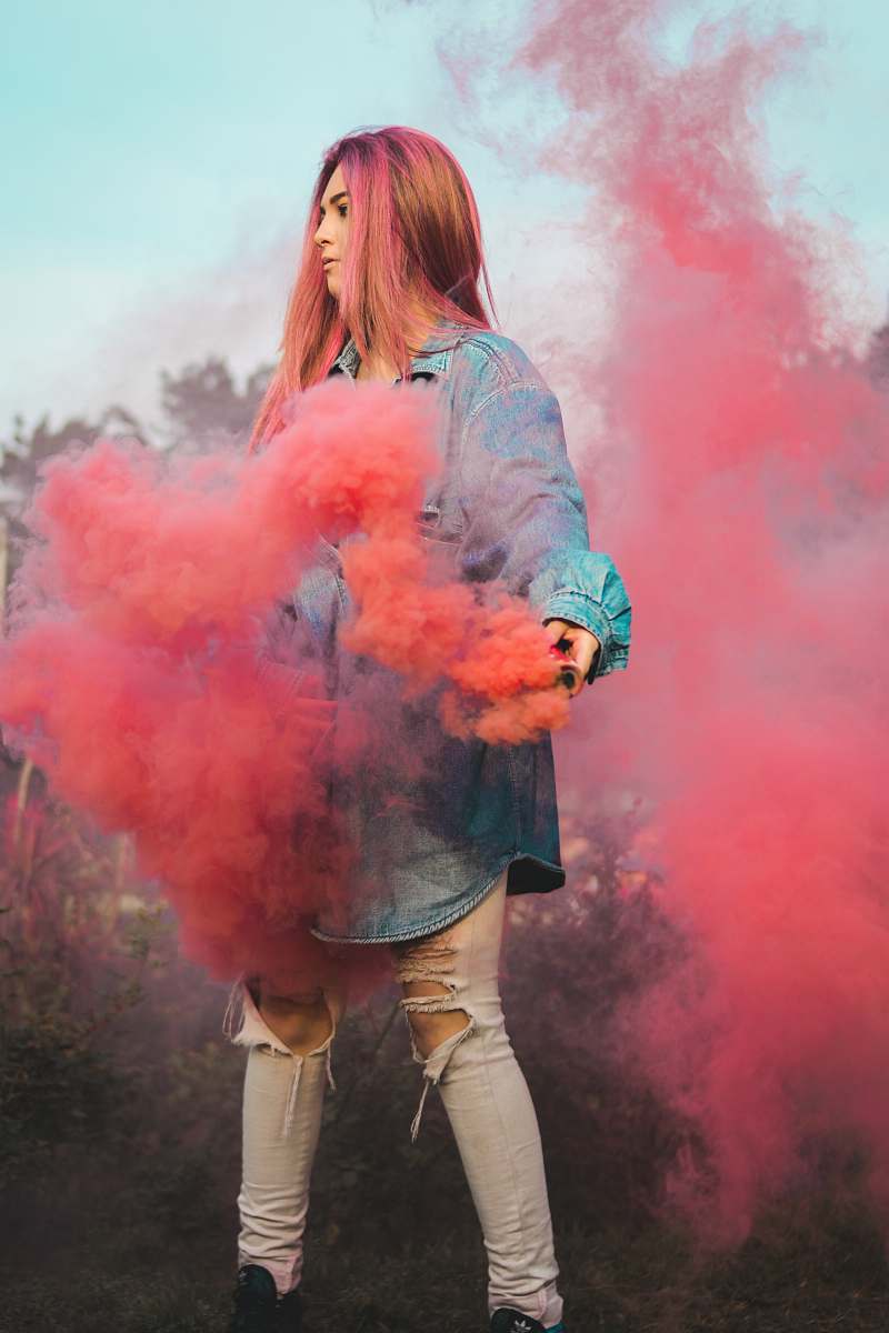 person woman holding red smoke human
