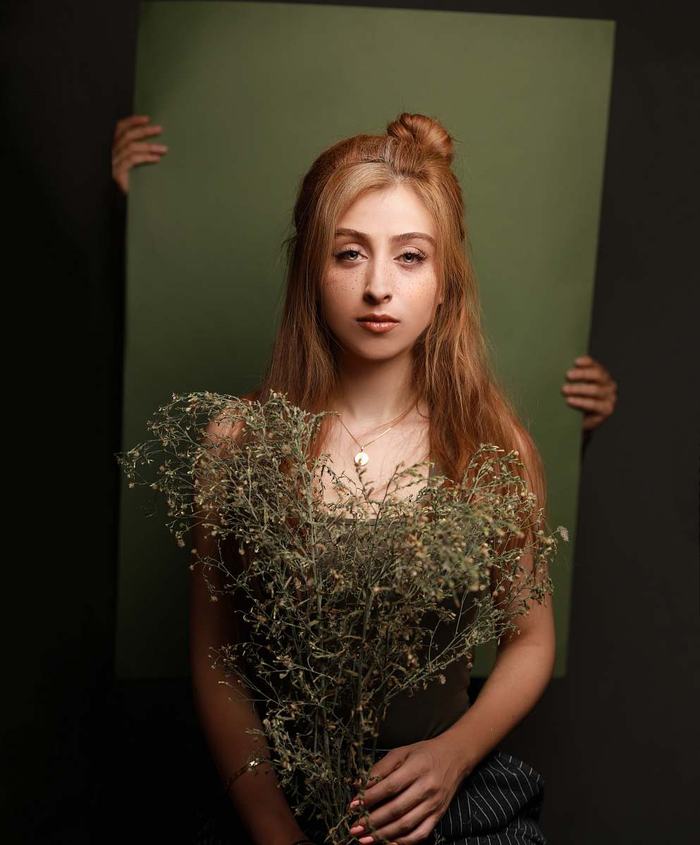 person woman holding withered plants plant