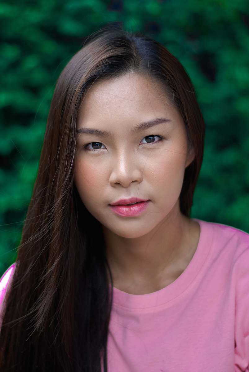 human woman in pink crew-neck shirt in closeup photography woman