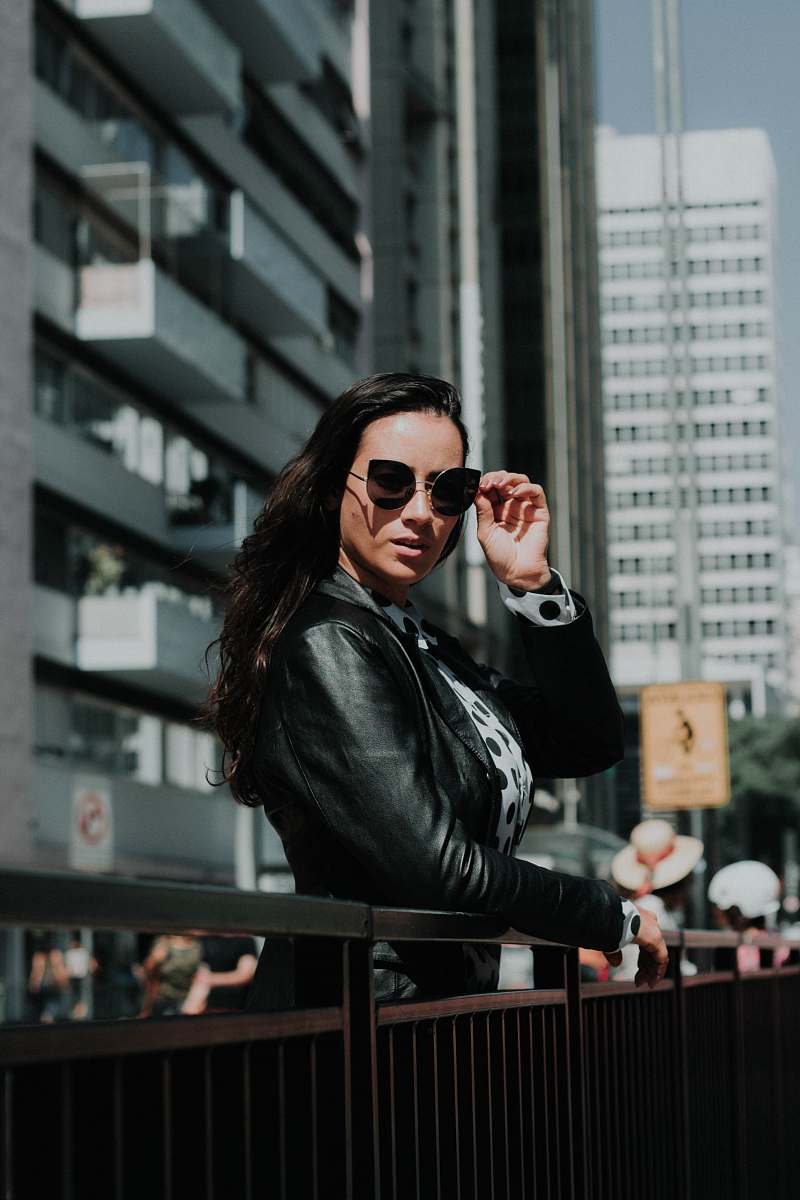 person woman leaning on metal handrail human