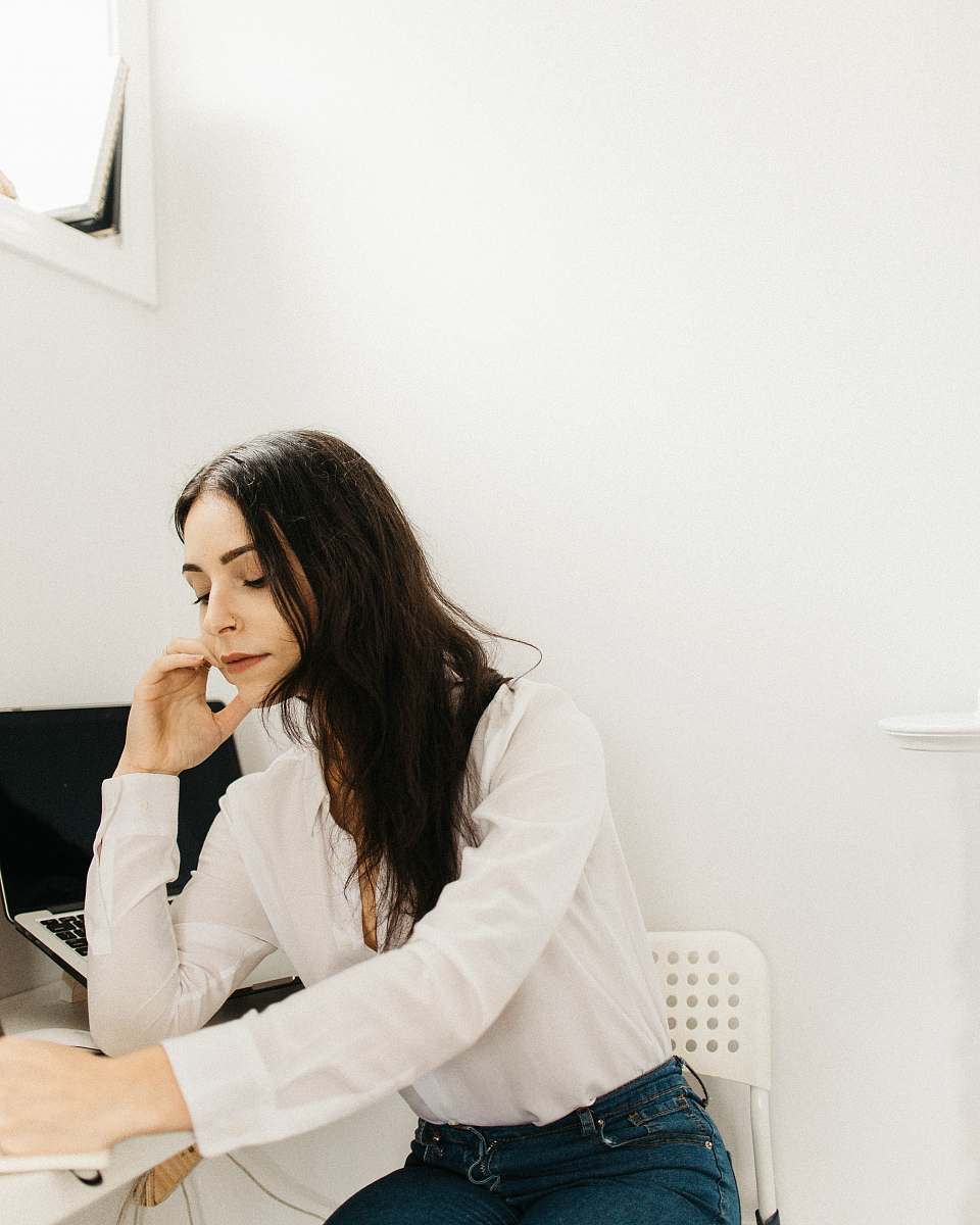 person woman leaning on white table human