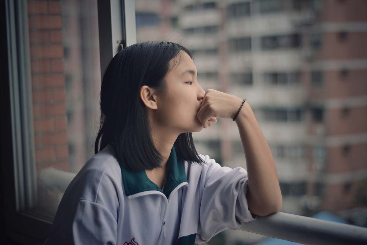 human woman looking through window person