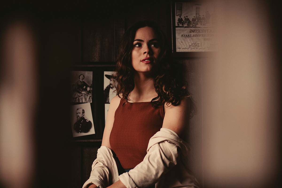 person woman sitting inside room during daytime human
