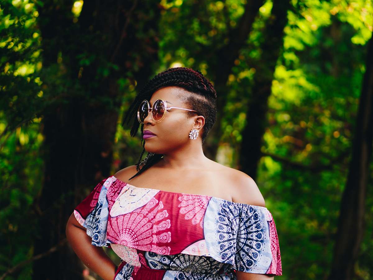 human woman standing in front of trees woman