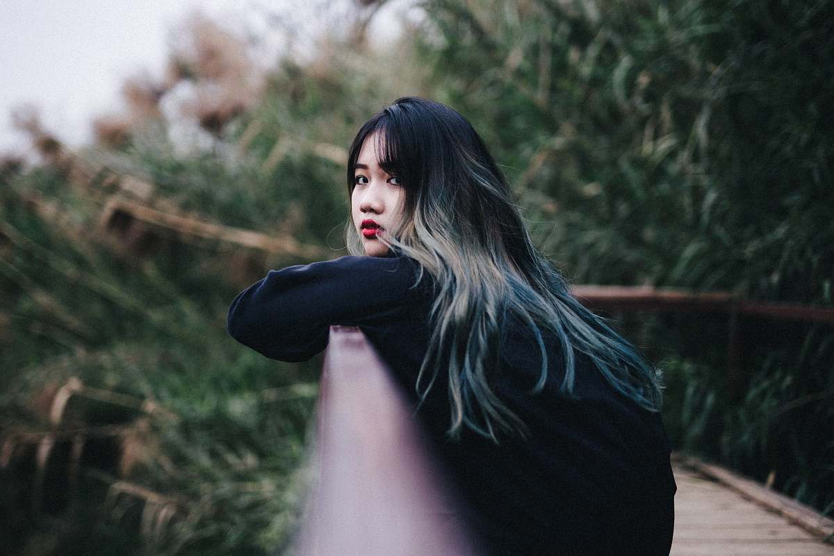 person woman standing on bridge human