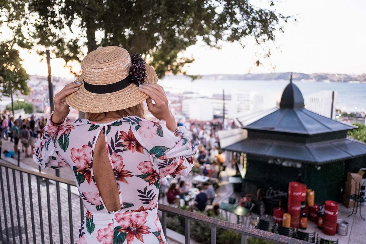 person woman touching her brown sun hat during daytime human