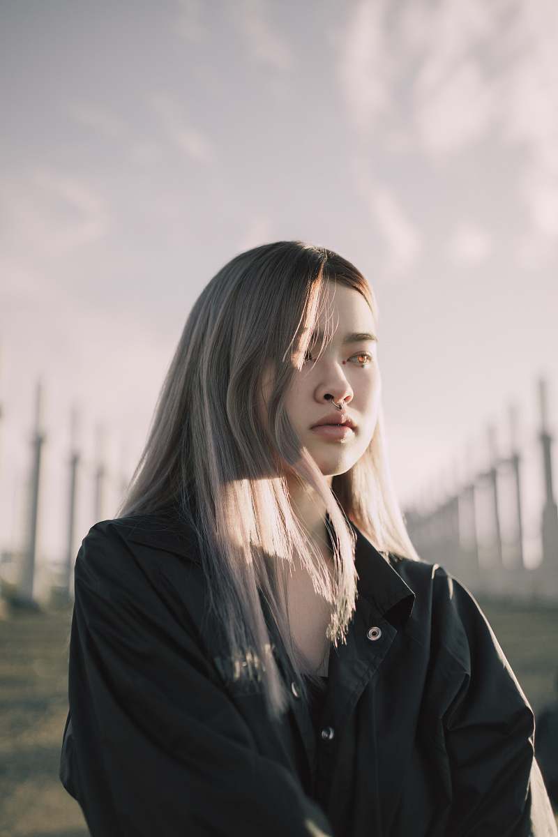 person woman wearing black button-up shirt human