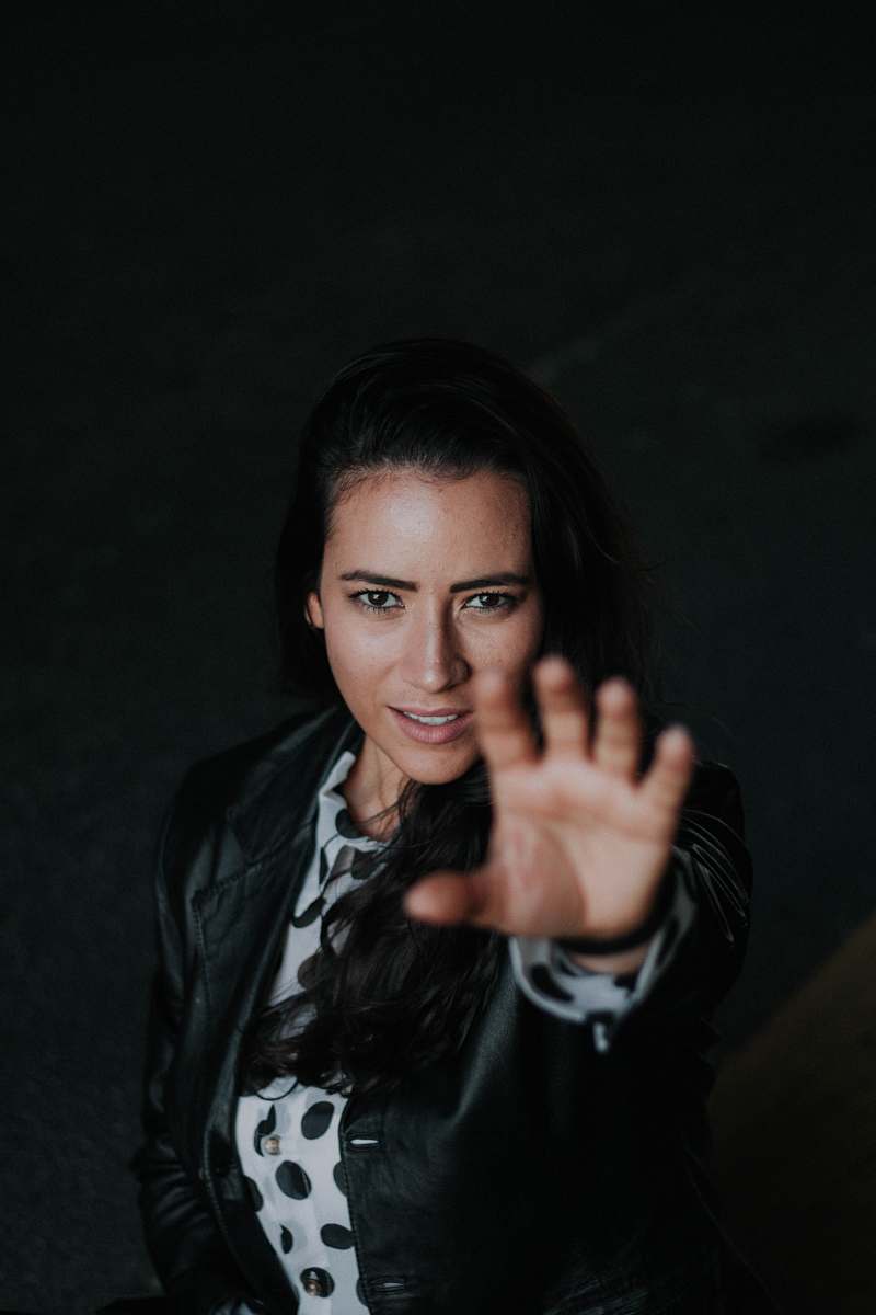 human woman wearing black leather jacket person