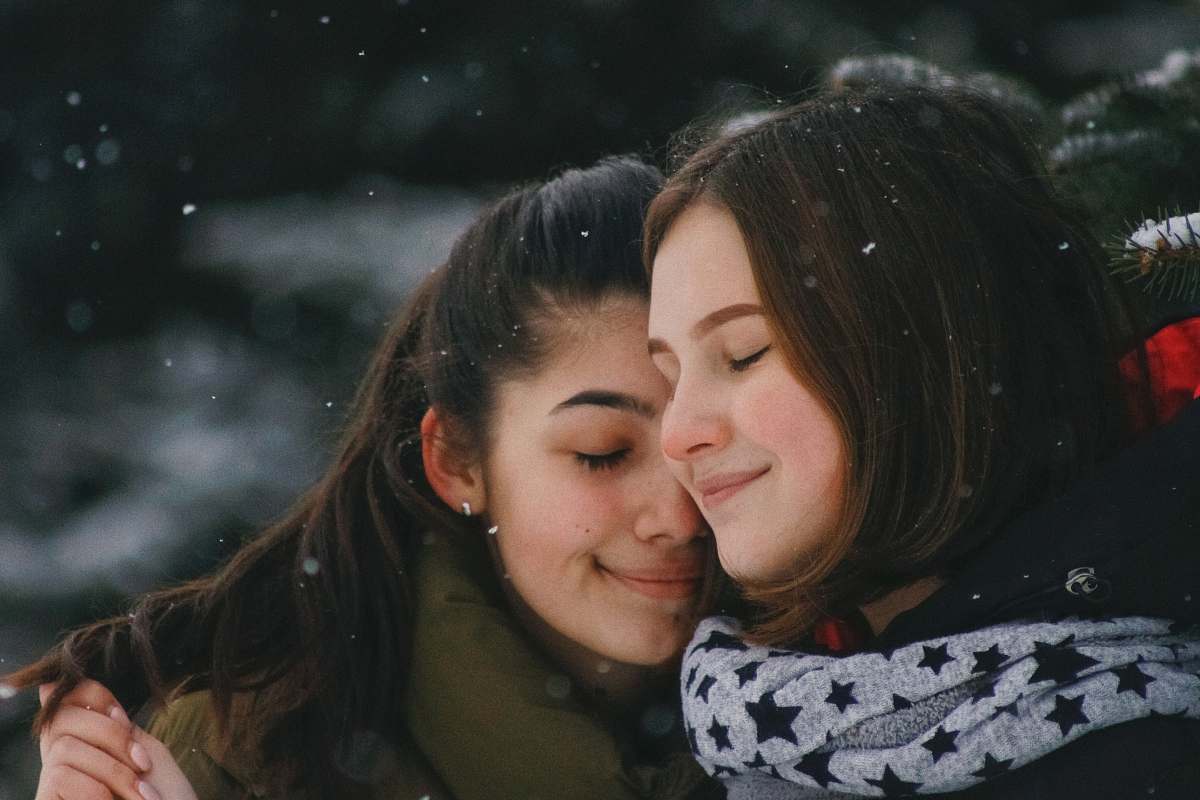 person women hugging each other human