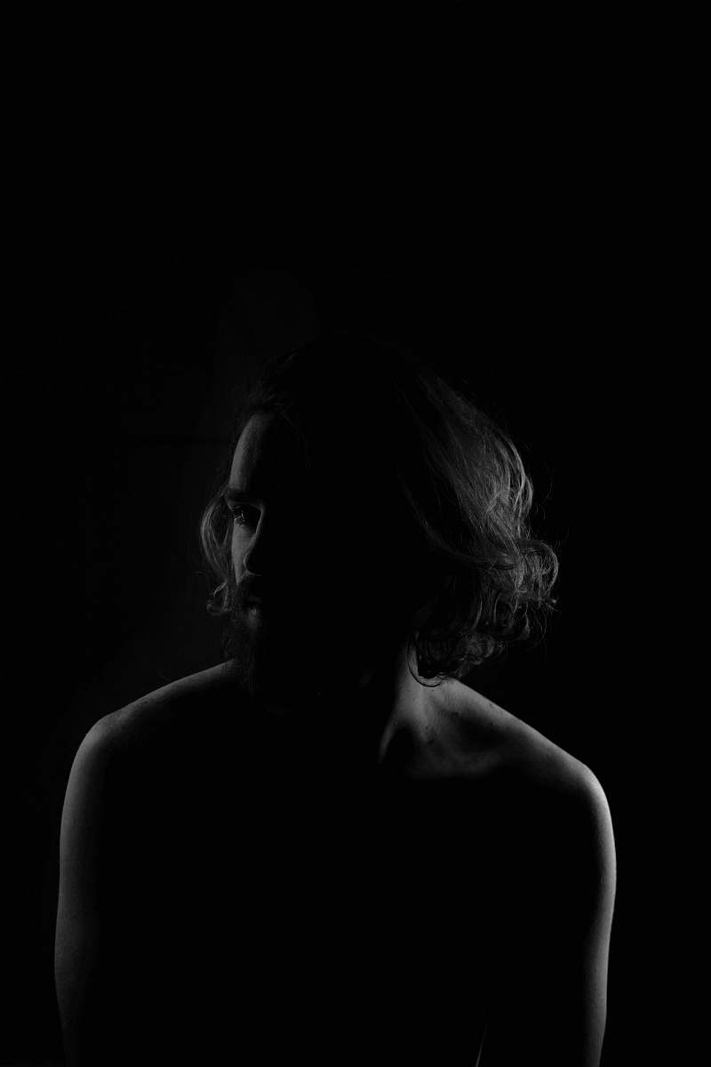 human grayscale photo of topless man black-and-white