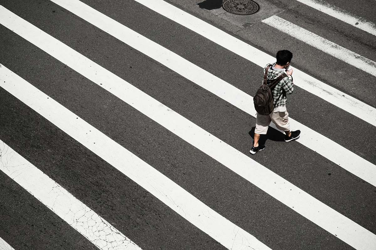 people man crossing at pedestrian lane zebra crossing