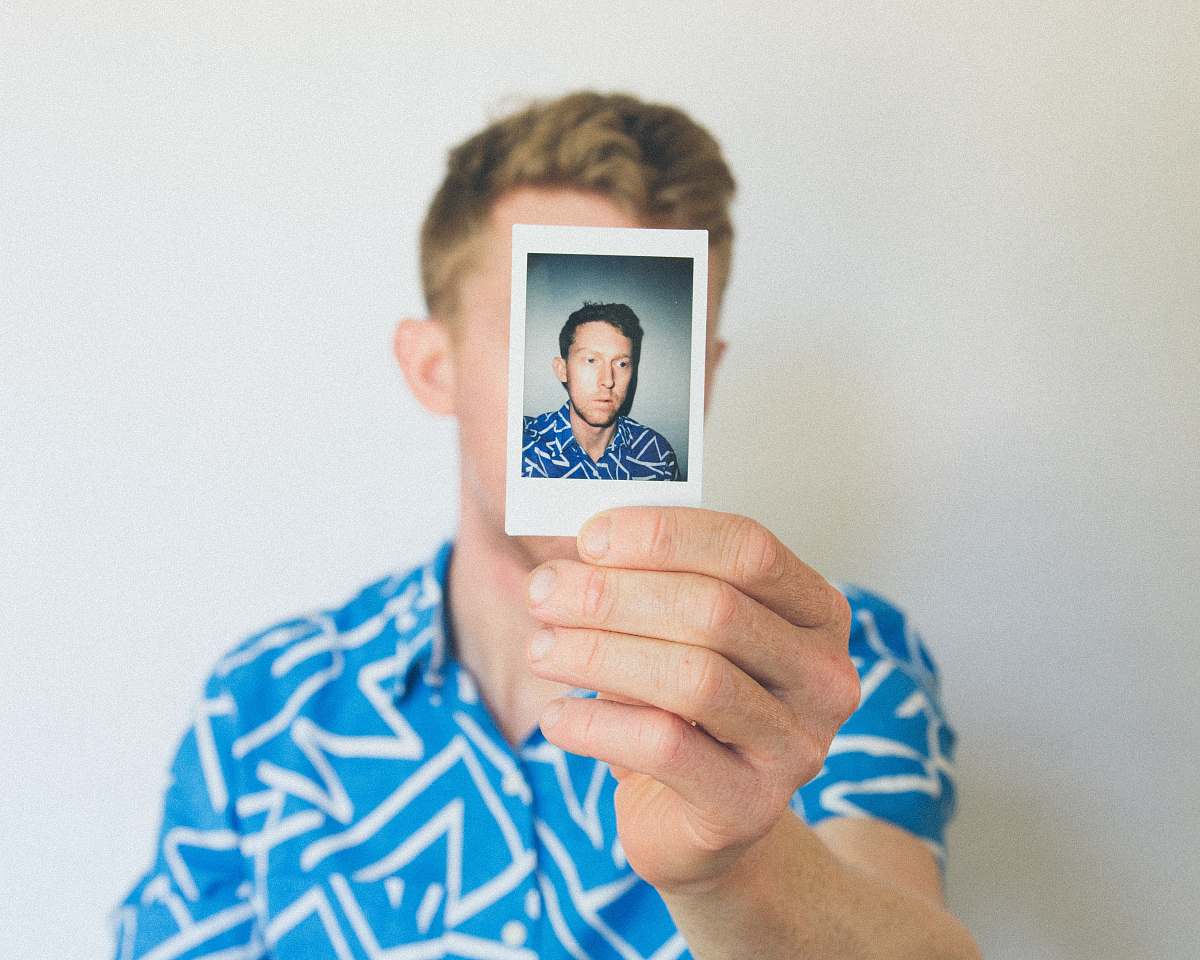 people man showing photo of him human
