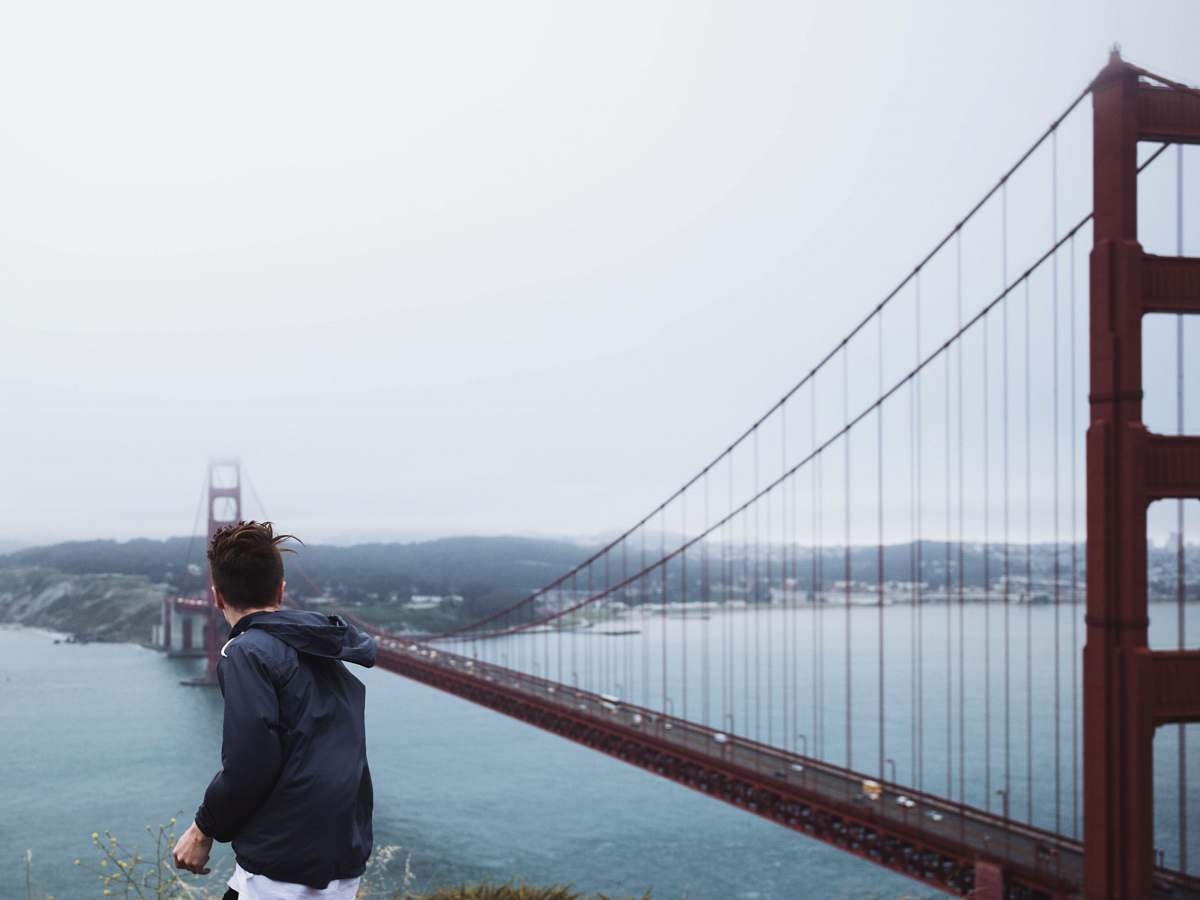 people man standing near Golden Gate Bridge san francisco