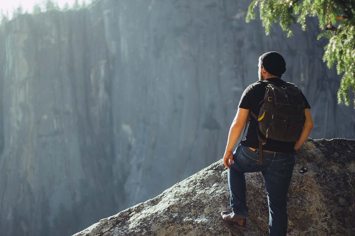 people man standing on gray stone human