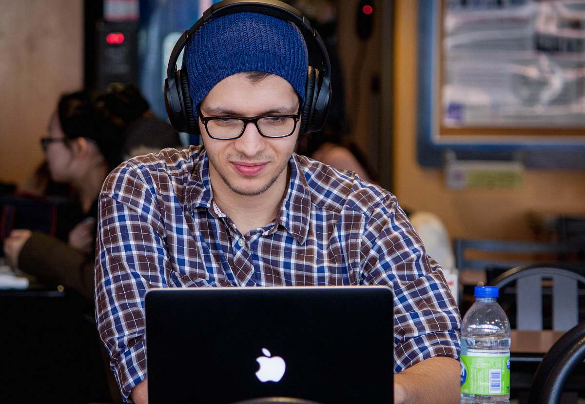 people man using MacBook during daytime human