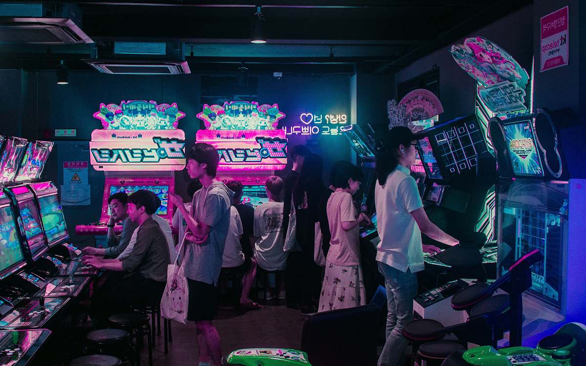people people playing arcade games human