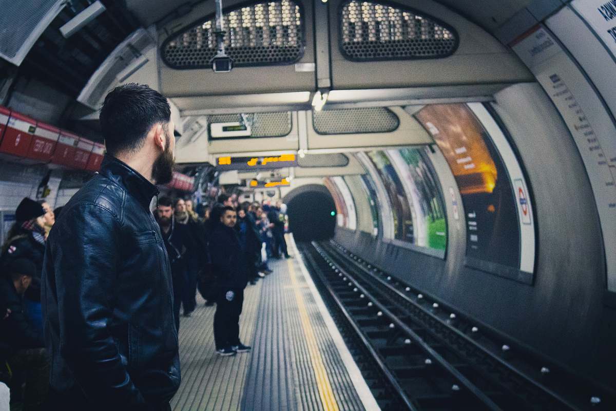 people people standing in train station human