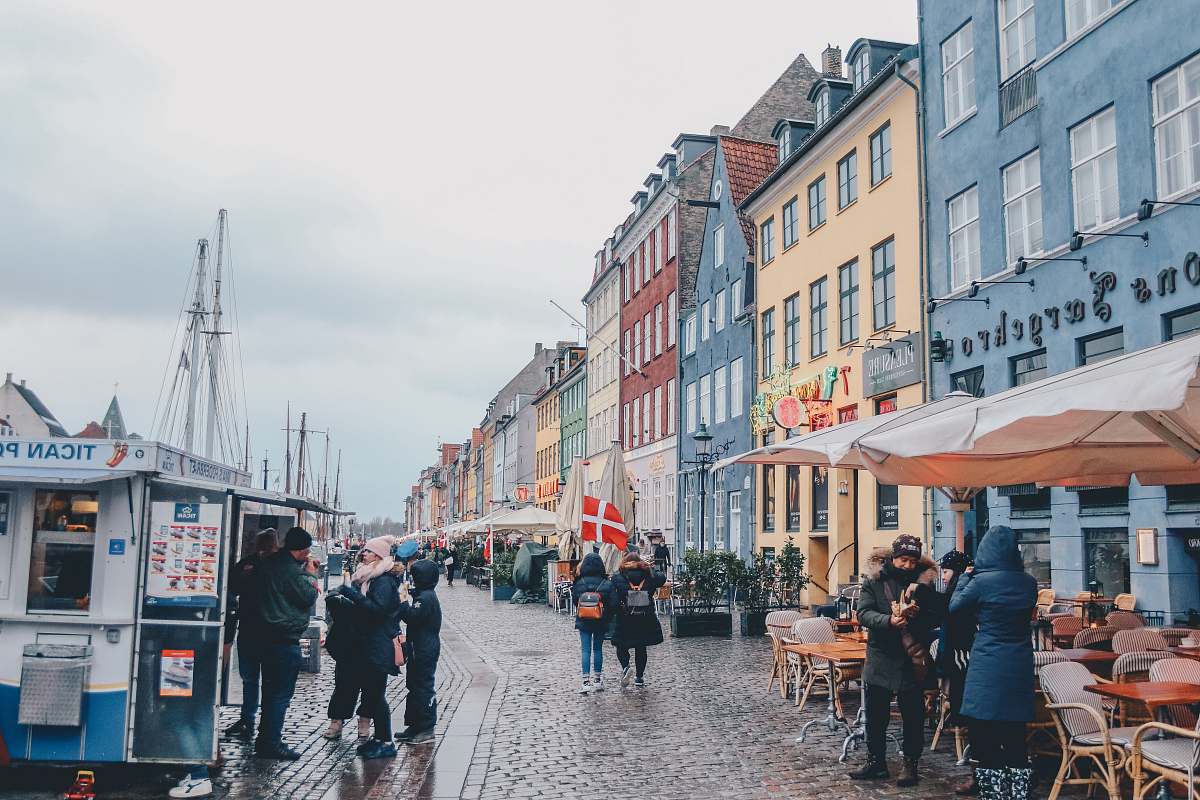 people people walking building under cloudy sky during daytime human