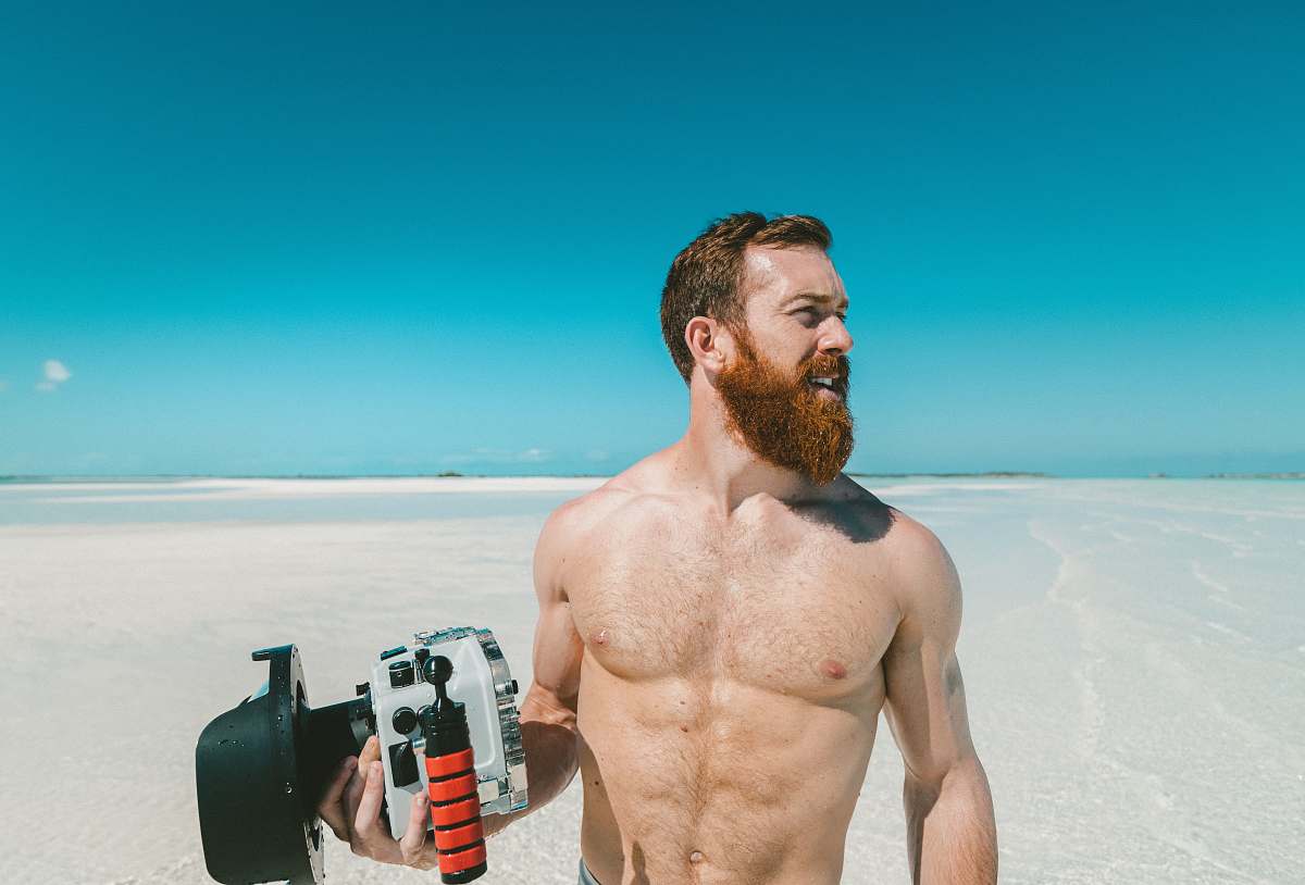 people person holding black and silver power tool human