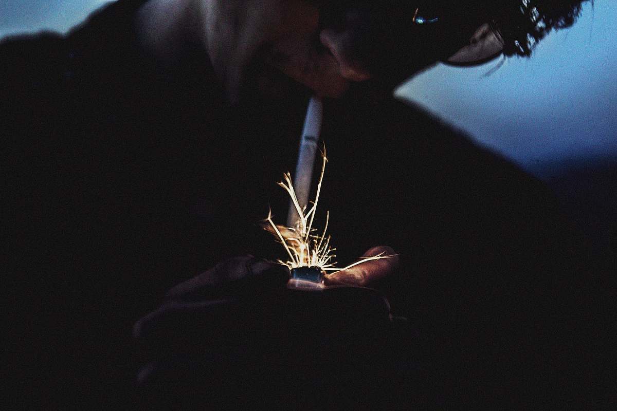 people person holding lighter human