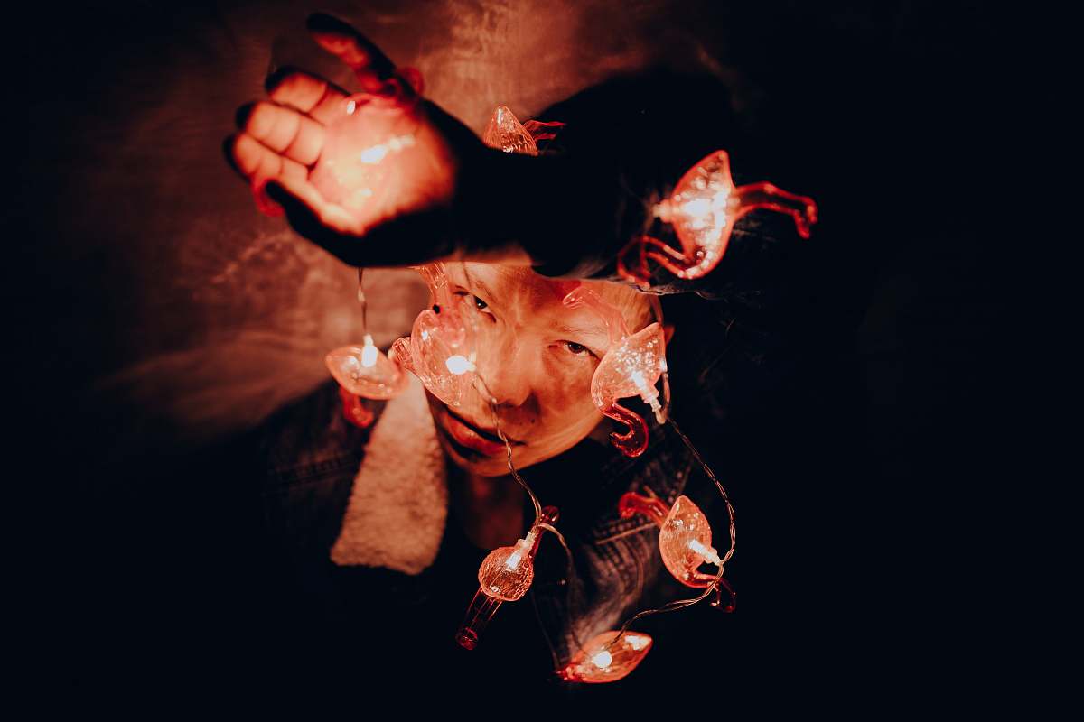 people person playing with fire in a dark room human