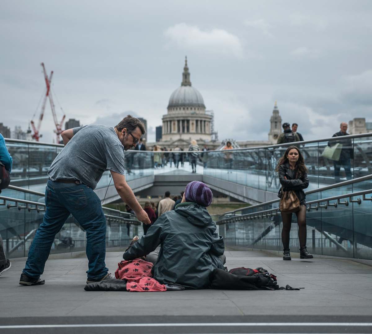 people person sitting on floor near people london
