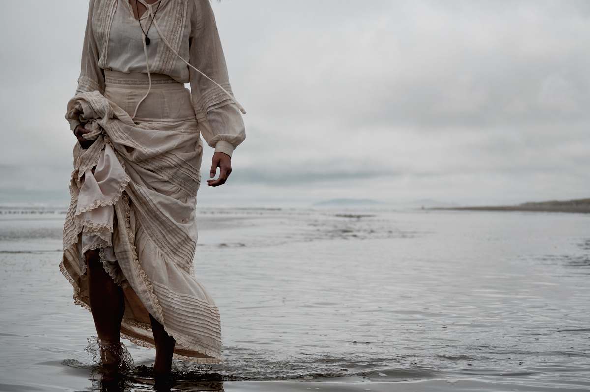 human person standing on sea shore people