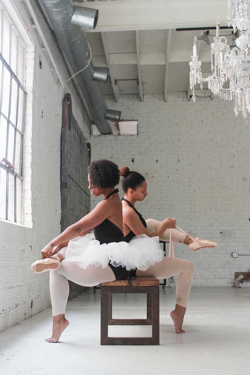 people photo of two ballerina tying their shoes human
