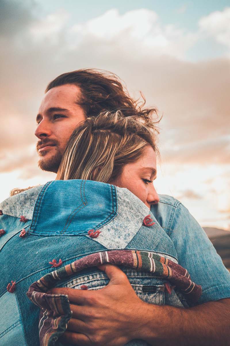 people selective focus photography of couple hugging human