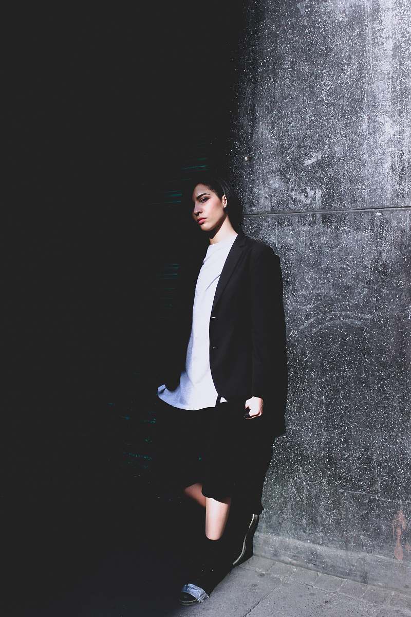 human woman leaning on wall people