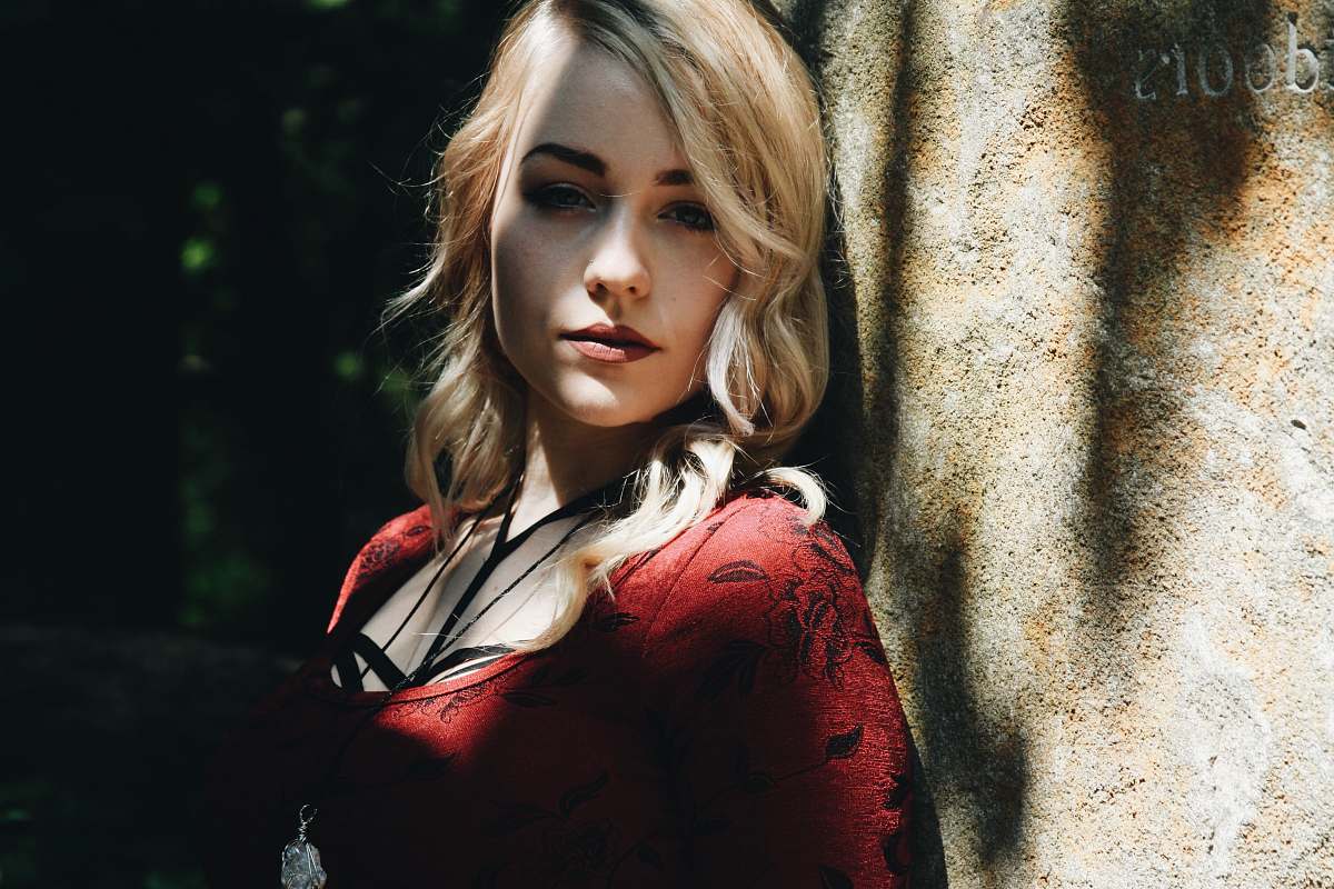 people woman leaning on wall human