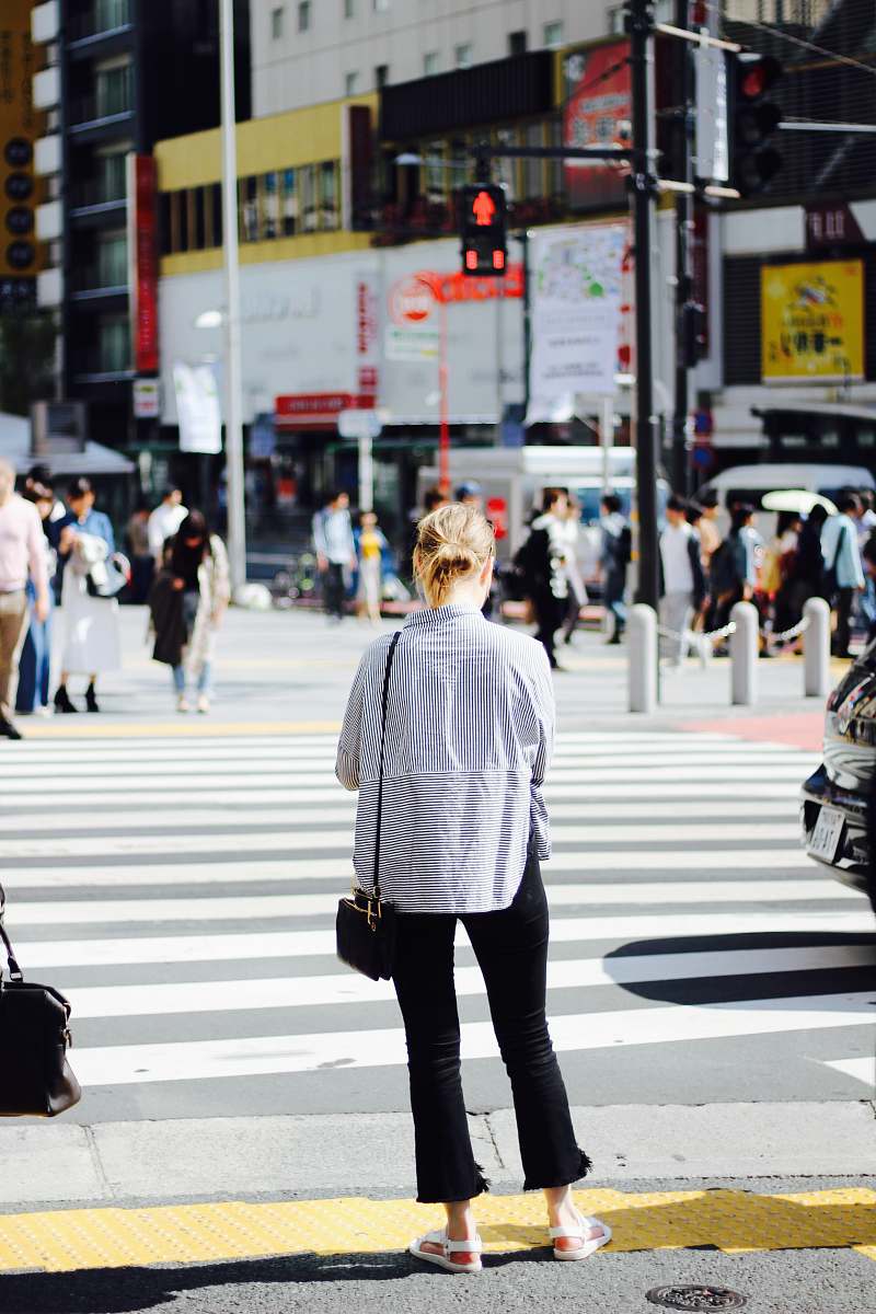 people woman standing in pedestrian lane human
