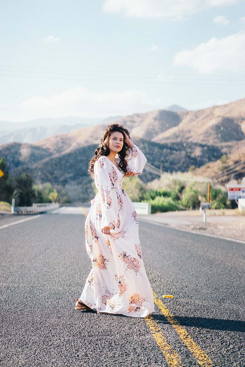 people woman standing in the middle of the road human