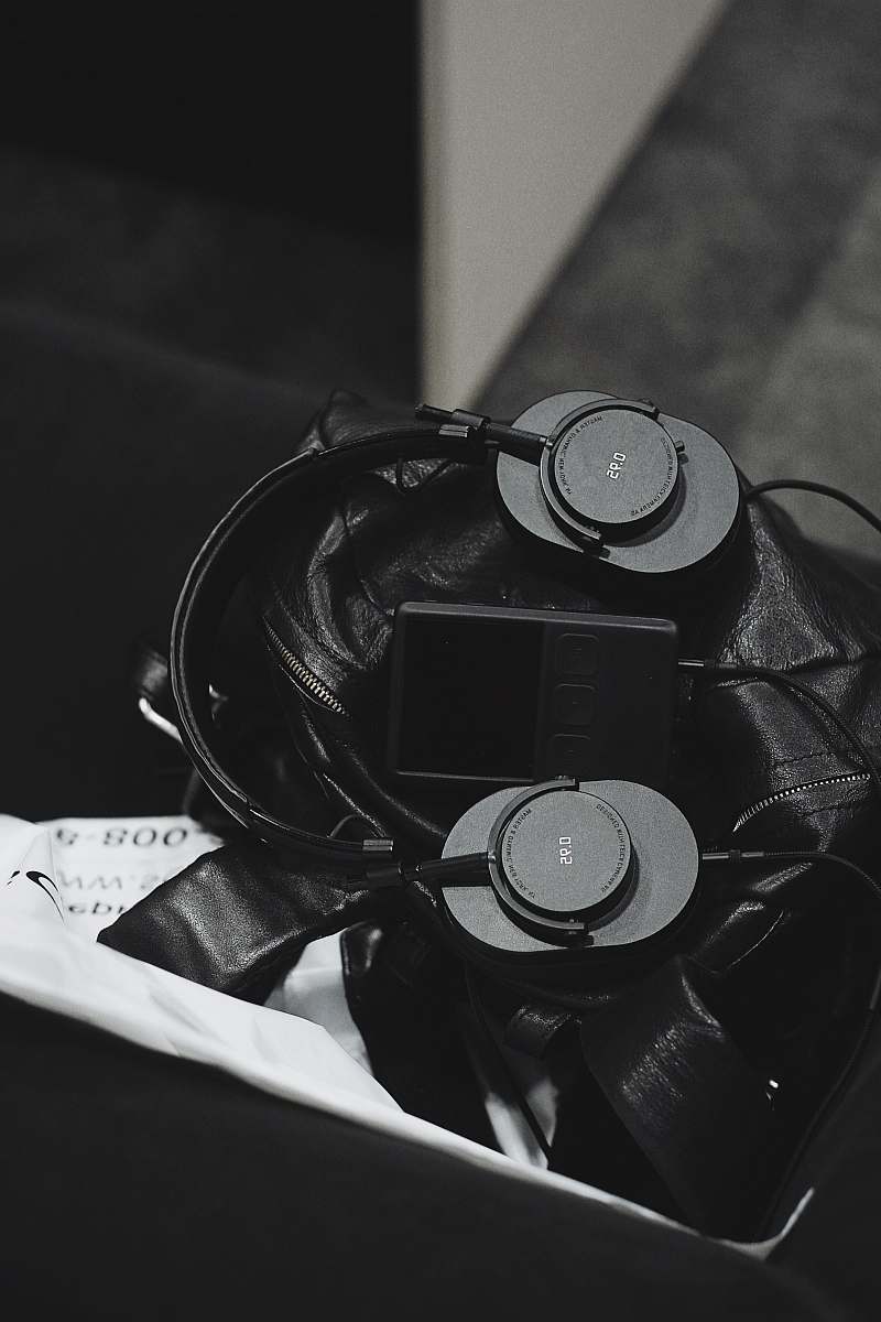 grey grayscale photo of headset and music player electronics