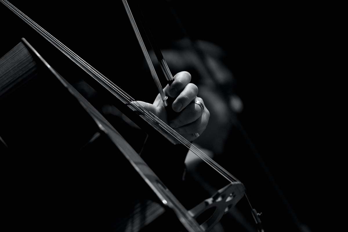 voghera grayscale photo of persons playing violin italy