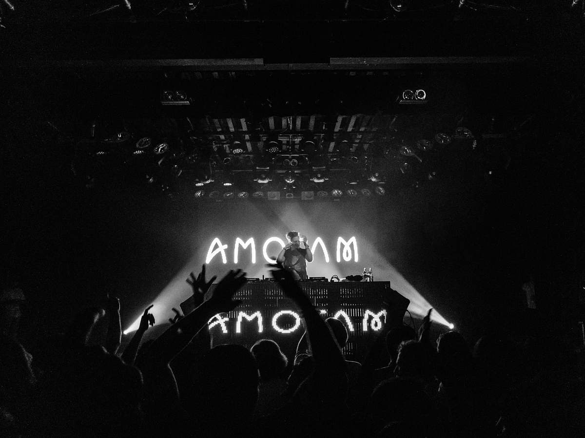 stage grayscale photography of people on party commodore ballroom