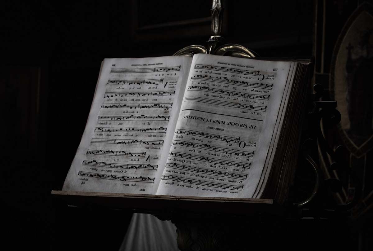 grey music notes on brown wooden easel music