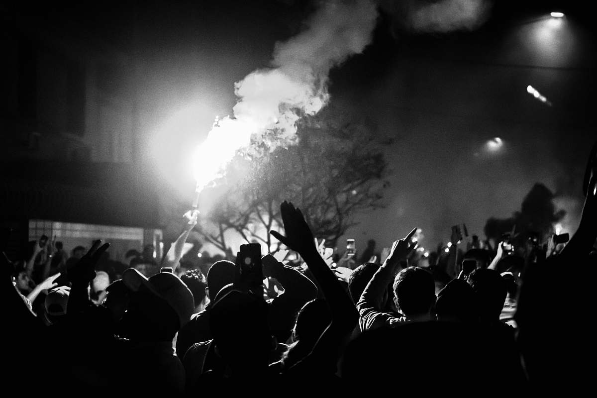 crowd people gathering on street during nighttime human